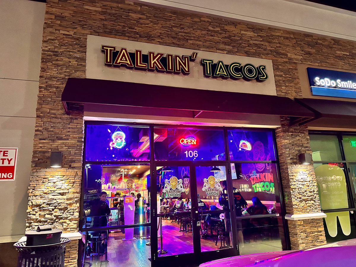 front of restaurant with talkin tacos sign